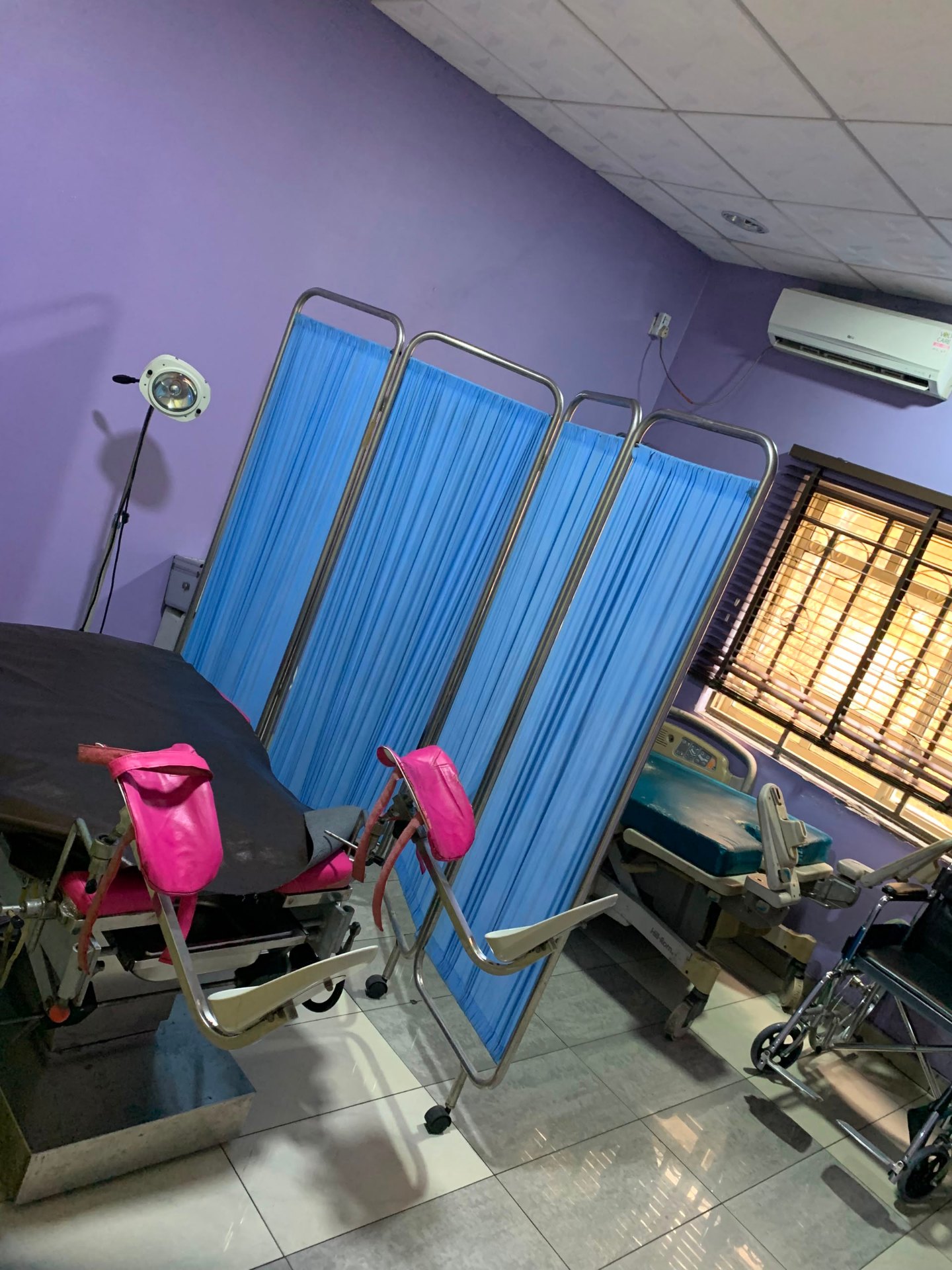 Labour and delivery room at Prestige Specialist Hospital with a delivery bed and privacy screens